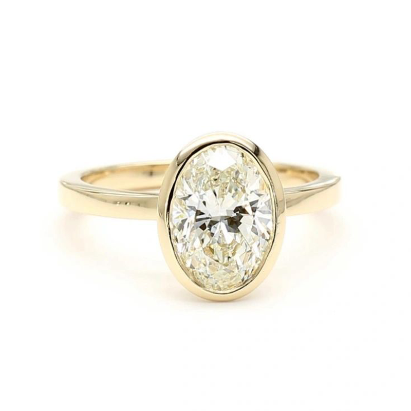 Oval bezel-set lab-grown diamond solitaire ring in 14K gold, 3 ctw
